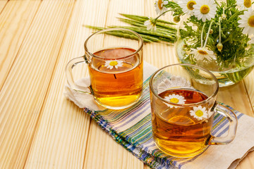 Chamomile tea. Fresh flowers, summer hot drink concept. Alternative medicine, lifestyle