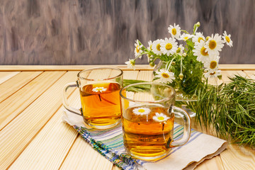 Chamomile tea. Fresh flowers, summer hot drink concept. Alternative medicine, lifestyle