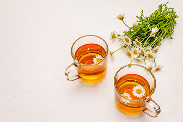 Chamomile tea. Fresh flowers, summer hot drink concept. Alternative medicine, lifestyle
