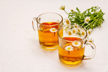 Chamomile tea. Fresh flowers, summer hot drink concept. Alternative medicine, lifestyle