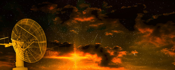 Radio telescope at the dawn of a starry night. Elements of this image furnished by NASA.