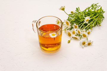 Chamomile tea. Fresh flowers, summer hot drink concept. Alternative medicine, lifestyle