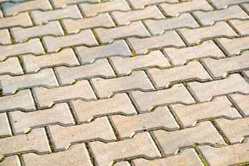 Closeup detail of gray concrete yard pavement slabs.
