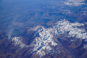 Obraz premium Landscape with mountains. Top view. Blue wallpaper. Shot from airplane.