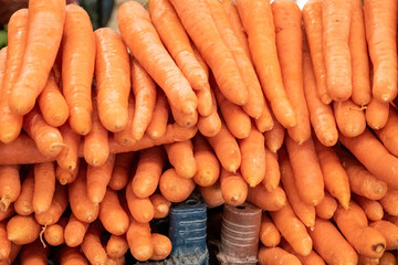 Organic carrots freshly harvested on a market counter