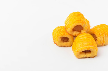 Pineapple roll tart cookies known as Tat Nenas isolated on white background. Modern cookies for Hari Raya Aidilfitri (Eid UI-Fitr) celebration. Pineapple tart isolated.