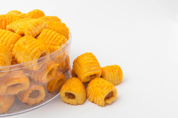 Pineapple roll tart cookies known as Tat Nenas isolated on white background. Modern cookies for Hari Raya Aidilfitri (Eid UI-Fitr) celebration. Pineapple tart isolated.
