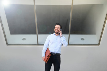 Young worker making phone calls