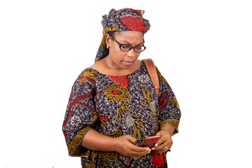 close up of african mature woman with mobile phone.