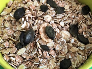 healthy food oatmeal and pumpkin seeds vegan Breakfast cereals macro photo