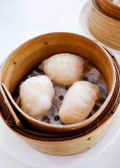 Chinese dumpling in a bamboo steamer box