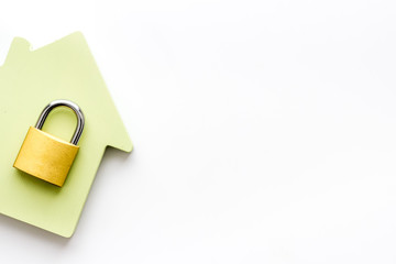 Security concept with lock and house figure top view copy space