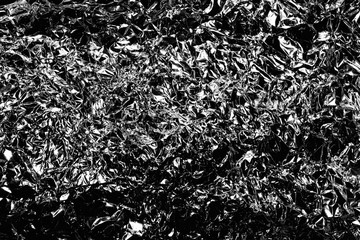 Dark crumpled foil as a background
