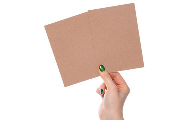 Craft paper card in female hand isolated on white