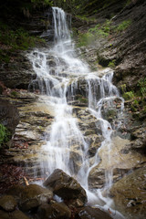 Fototapeta na wymiar Beautiful waterfall into the wild
