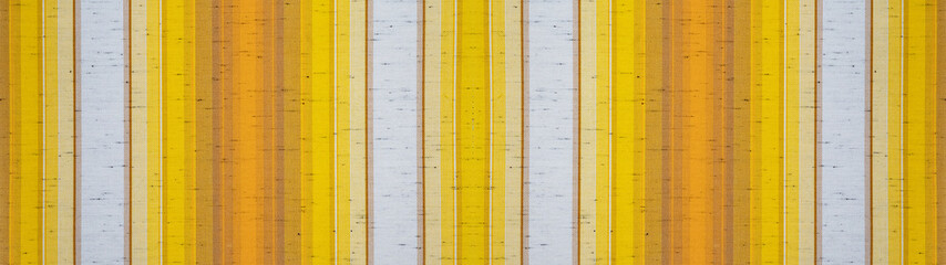 Yellow mustard orange white striped natural cotton linen textile texture background banner panorama 