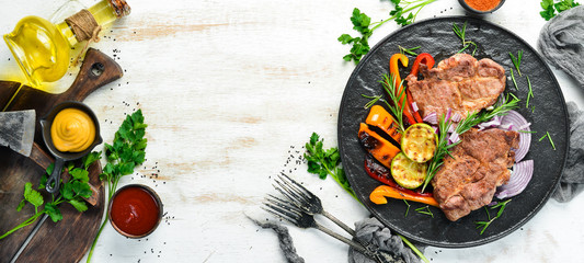 Beef steak. Juicy veal steak with rosemary and spices. Top view. Barbecue.