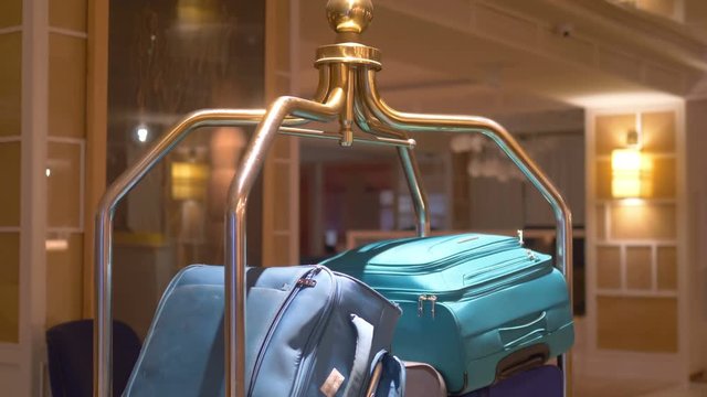 Suitcases on the luggage trolley in 4k slow motion 60fps
