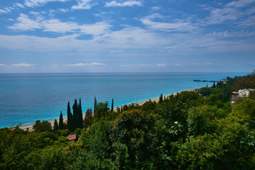 Sky clouds sea mountains trees