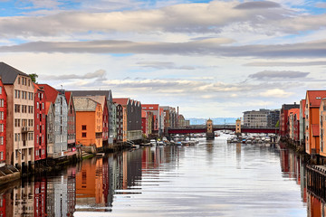 Bakklandet in Trondheim, Norway. This idyllic neighborhood on the east side of the Nidelva river features colorful old wooden buildings. Architecture, buildings, travel and photography concept.