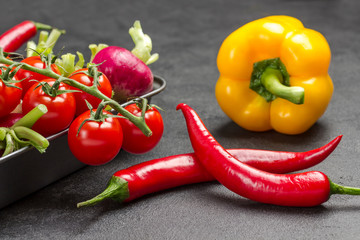 Raw Colorful vegetables in metal baking dish.