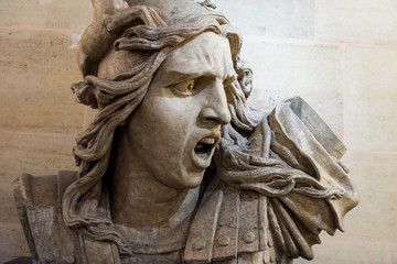 Statue of yelling man inside of the Arc de Triomphe at the Champs-Elysees Avenue in Paris, France