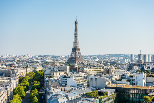 Aerial view of the old town of Paris, with the building of Eiffel tower, from the top of the Arc de Triomphe at the Champs-Elysees Avenue in Paris, France