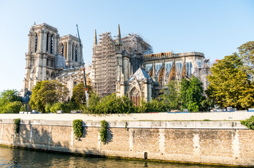 Obraz premium Reconstruction of Notre-Dame de Paris after the big fire, a medieval Catholic cathedral on the Ile de la Cite in the 4th arrondissement of Paris, France.