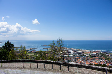 The view from the top of the Santa Luzia hill. Aerial view of Estaleiros Navais de Viana do Castelo (ENVC shipyard), Limia River and the Atlantic Ocean in Northern Portugal.