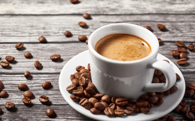 A cup of coffee is on the table.