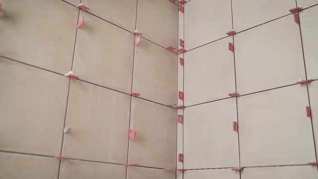 aying ceramic tiles. Ceramic wall tile. Tiles in the bathroom. L