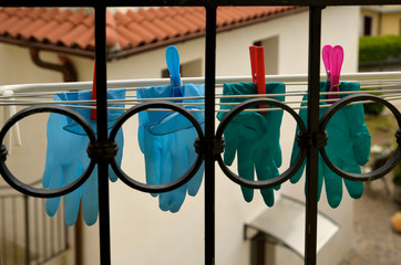 Protective gloves from covid 19 hung out to dry