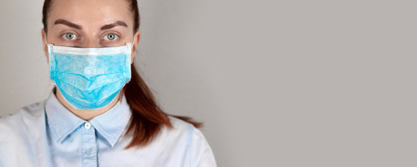 Young girl in a medical mask feels bad. Sore throat, illness. Coronavirus, covid 19