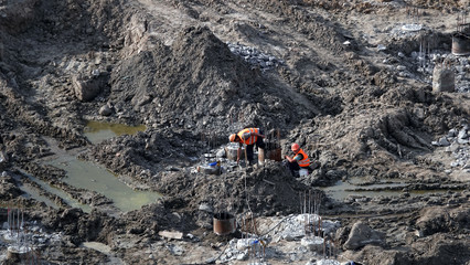 Workers - zero-cycle construction of the foundation of an entertainment center