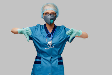 female doctor with stethoscope wearing protective mask and latex gloves over light grey background