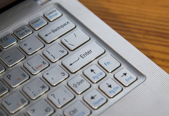 
Computer keyboard with enter button to stimulate action.