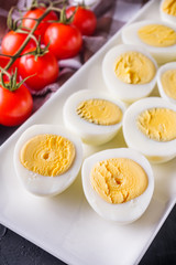 boiled chicken eggs on a dark stone background