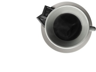 A cup of black coffee on a plate with dark chocolate on the white background. Photo in gray colors, top view.