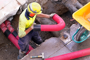 construction worker for restoir and repair pipes for underground electrical wiring conduction