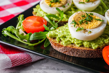 tasty and nutritious avocado sandwich and boiled egg