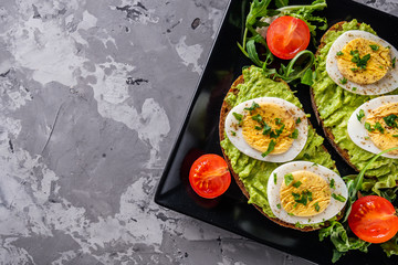 tasty and nutritious avocado sandwich and boiled egg