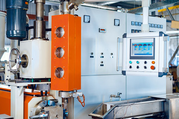 Close up photo of production in the industry with various machines