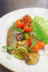 Fried walleye fillet with potatoes, leek and mushrooms