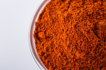 aromatic spicy chili powder on a white background