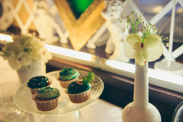 Delicious sweet buffet with cupcakes. Sweet holiday buffet with cupcakes and other desserts. Candy Bar.