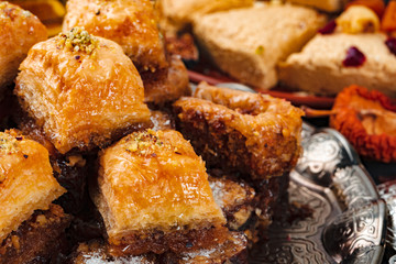 Turkish arabic desserts on silver plate close up