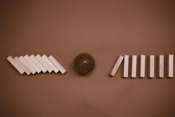 Business risk management concepts. Wooden block stop falling of other pieces of domino effect.