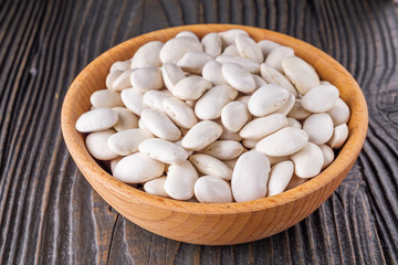 Fresh organic natural beans on wooden rustic background
