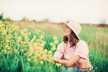 girl in a field. Summer time. Woman hat. Happy day. Field. Vacation. 