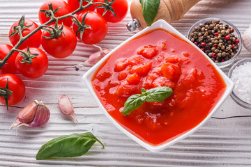 juicy canned tomatoes on wooden rustic background